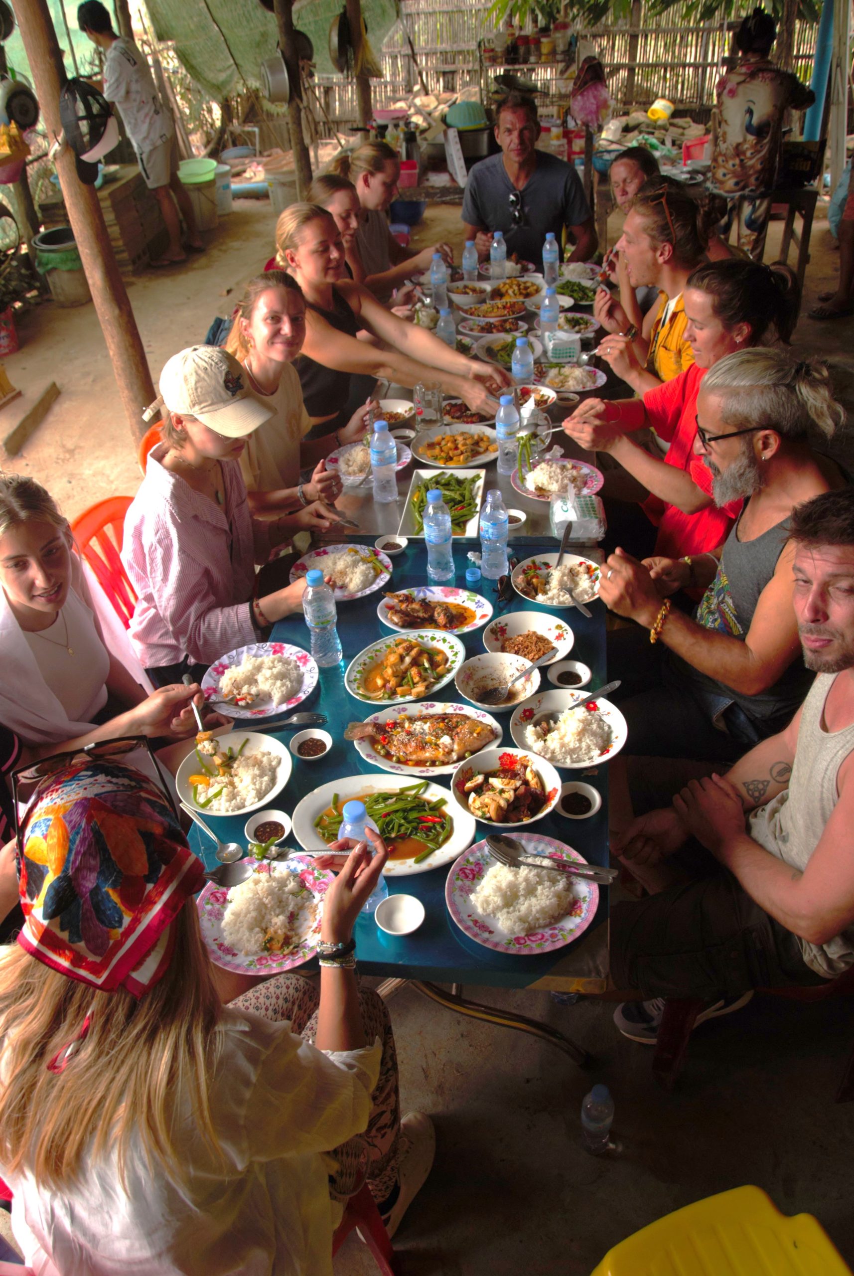 Vin serving lunch to guests inside her 120-year-old wooden home